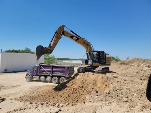 excavator moving dirt