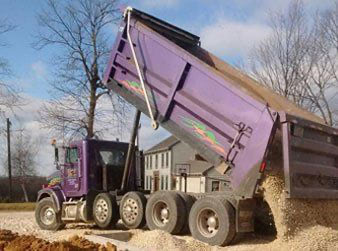 Dump truck pouring out a load of gravel